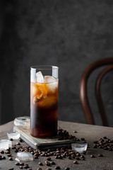 Black coffee with ice cubes . Refreshment beverage for hot days.