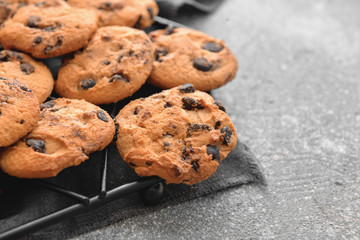 Tasty cookies with chocolate chips on table