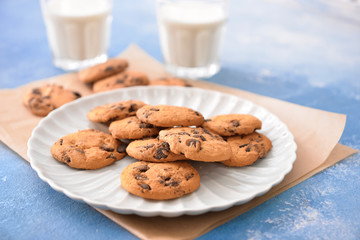 Plate with tasty cookies on table