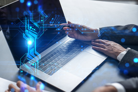 Two business people working together on it project. Brainstorm concept. Hi-tech hologram. Multiexposure.