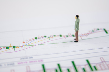 Stock market charts and business people on money