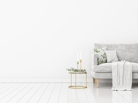Living room interior mockup with grey sofa, pillows, coffee table, candles and eucalyptus branches on empty white wall background. Trendy minimalist Christmas decoration. 3d rendering, illustration.