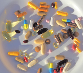 supplements drugs medication bev on a white plate