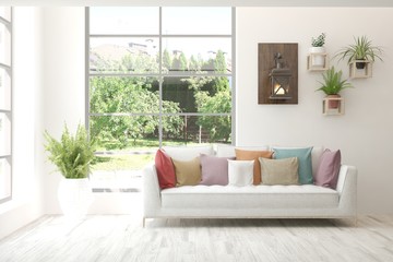 White living room with sofa and summer landscape in window. Scandinavian interior design. 3D illustration