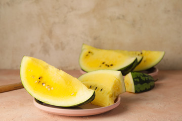 Cut yellow watermelon on table