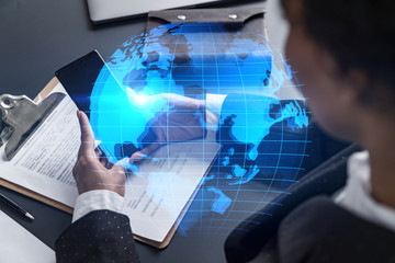 Businesswoman using phone, work in modern office on new project. Double exposure. Concept of success. World map planet earth hologram.
