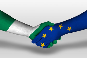 Handshake between european union and nigeria flags painted on hands, illustration with clipping...