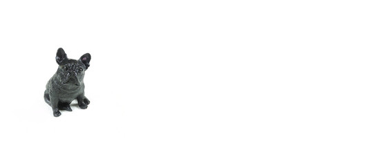 black figurine pug dog figurine, isolated on white background, copy space 