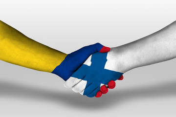 Handshake between finland and columbia flags painted on hands, illustration with clipping path.