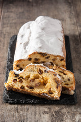 Christmas stollen fruit cake on wooden table	