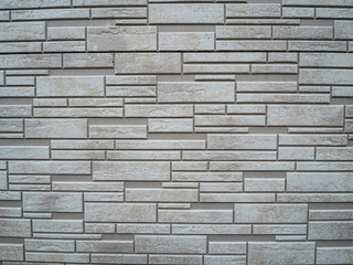 gray stone tiles on the wall of the house
