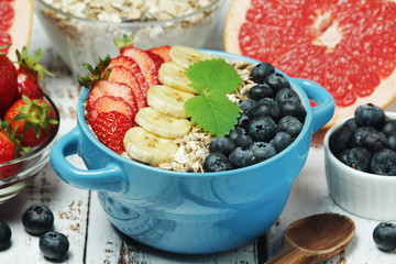 Healthy diet breakfast including cereal with berry and fruits