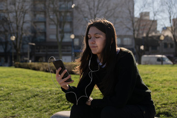 woman with smartphone in the sun social media concept