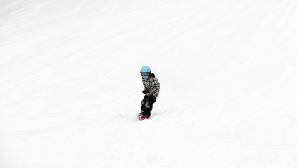 FEB 17, 2018 IWATE, JAPAN : Asian children snowboarder is riding with snowboard from powder snow...