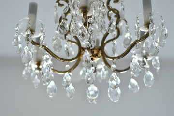 Chandelier background - Luxury crystal chandelier hanging from the ceiling indoors