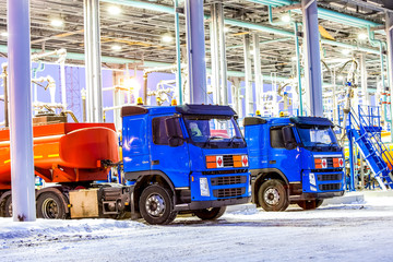 trucks at gas station on oil refinery factory