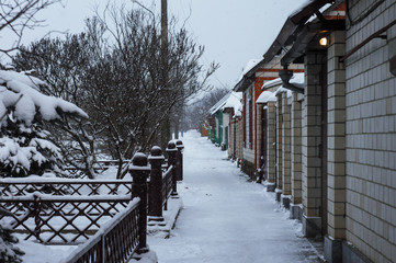 Winter snow-covered Russian street, private sector. High quality photo