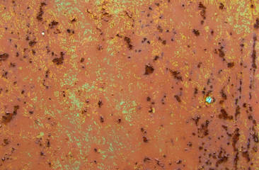 old metal door with peeled paint and rust