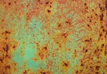old metal door with peeled paint and rust