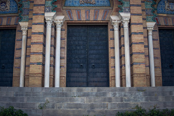 Fototapeta premium entrance to an old church in a park in Seville