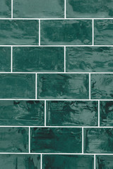 Traditional classic rustic tiled texture background in dark racing green shot straight on.