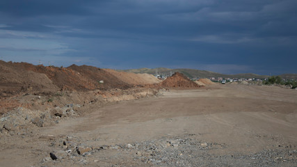 Road construction. Laying a new road in the steppe. Kazakhstan, Ust-Kamenogorsk