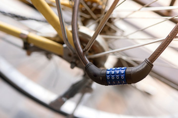 Fototapeta na wymiar Close up of combination bike lock in front of bicycle