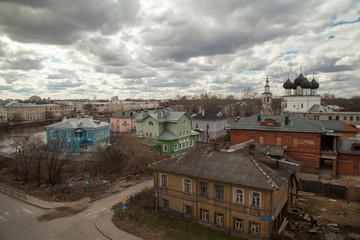 Russian autumn townscape with bright  Cottages