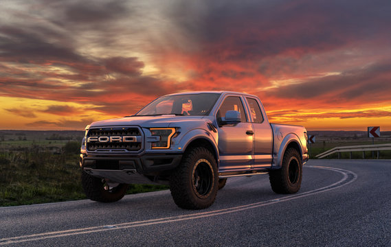 Ford F-150 Raptor - Most Extreme Production Truck On The Planet standing on the road at sunset