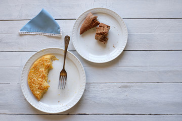 Piece of potato omelette and bread