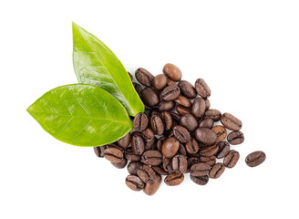 coffee beans and green leaves on a white background