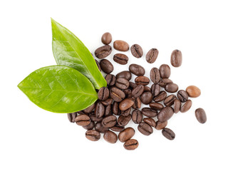 coffee beans and green leaves on a white background