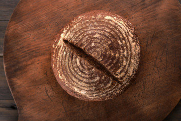 Bread bun round on a wooden background