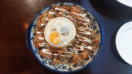Pork pilaf and fried eggs