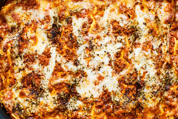 Close-up of hot homemade lasagne bolognese top view