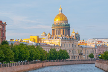 Fototapeta na wymiar View of St. Isaac's Cathedral and Moyka river in Saint Petersburg, Russia