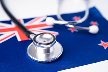 Black stethoscope on New Zealand flag background, Business and finance concept.
