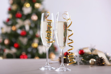 glasses with champagne on the table. Background with place for text for the new year holiday