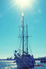 Sailing ship on the river embankment