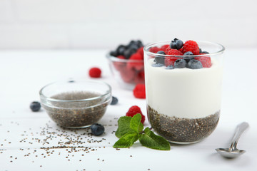 chia pudding with natural yogurt and fresh berries close-up on the table.
