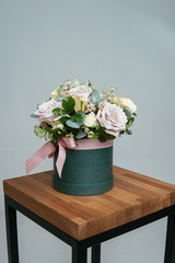 Bouquet of flowers in green hat box