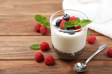 chia pudding with natural yogurt and fresh berries close-up on the table.
