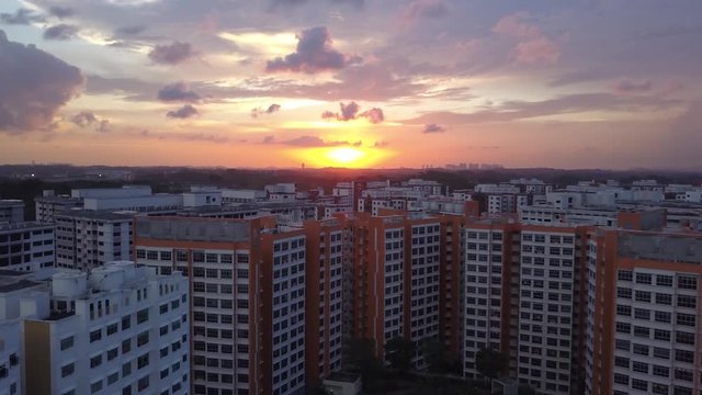 Splendid Morning Sunrise Over The HDB Apartment Flats In Choa Chu Kang, Singapore - push-in drone shot