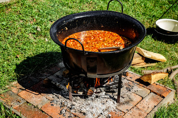 traditional Hungarian goulash soup in the cauldron