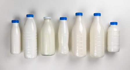 Dairy products packaging on white background, top view