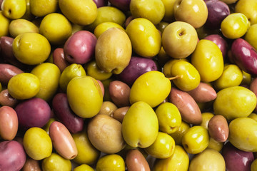 Tasty mix olives background.