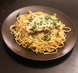 Chicken piccatta with spaghetti and lemon capers