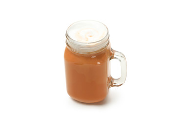 Glass cup of pumpkin latte isolated on white background