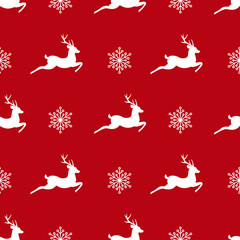 seamless winter pattern with white snowflakes and deers with antlers.