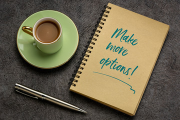 Make more options! Motivational handwriting in a sketchbook with a cup of coffee. Business and personal development concept.